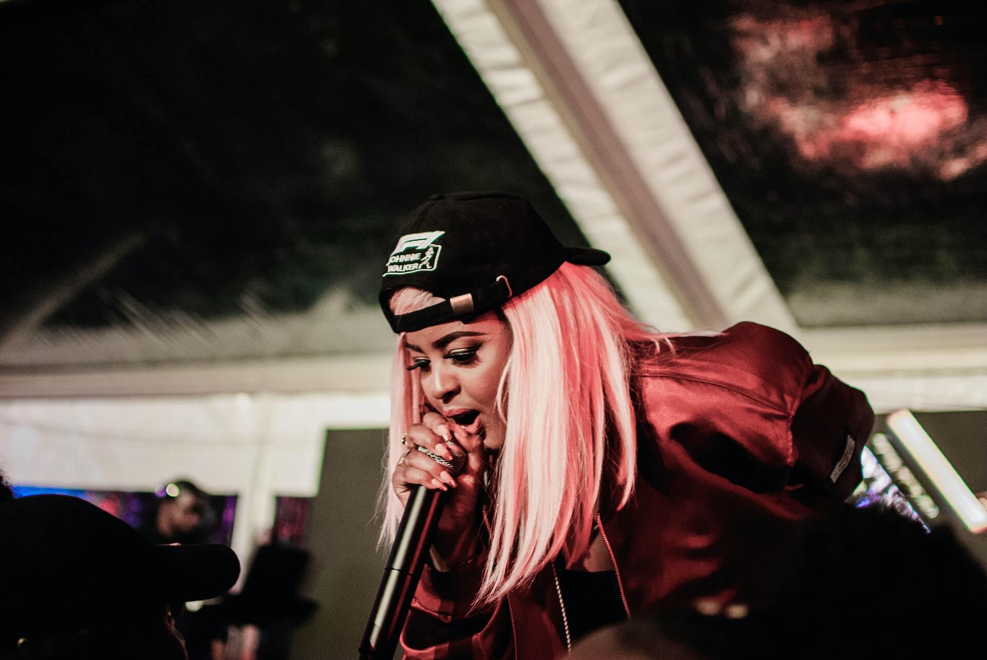 female hip-hop artist performing on stage